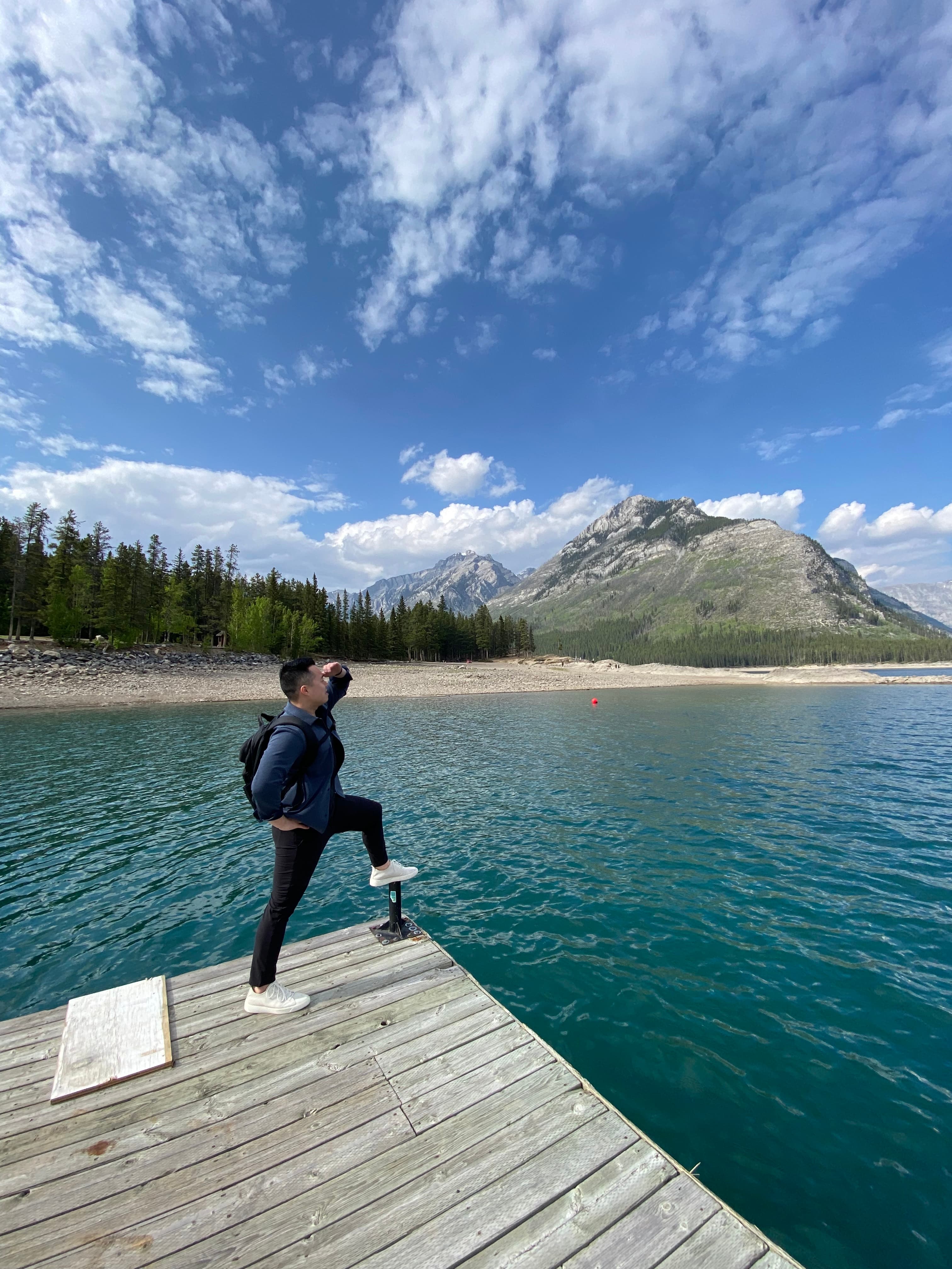 Michael Lee looking out over a mountain lake in Banff
